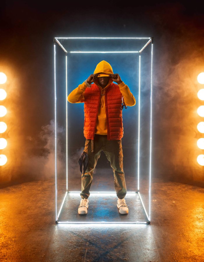 stylish-rapper-poses-in-illuminated-cube-BCRQ2AT.jpg
